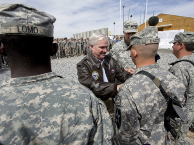 Secretary of Defense Robert M. Gates participates in a promotion ceremony during a visit with the Marine Corps' 1st Battalion, 17th Infantry Regiment March 9, 2010, at a forward operating base in Afghanistan.