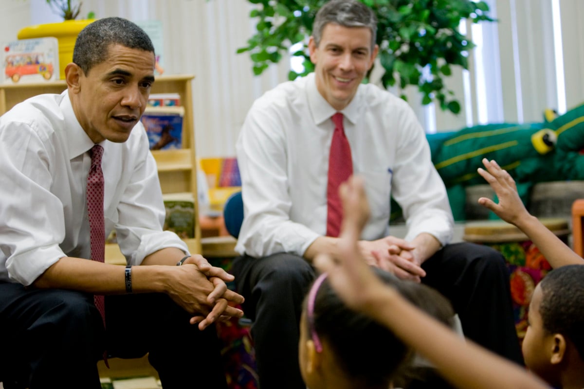 President-elect Barack Obama and Chicago Public Schools CEO Arne Duncan, right, talk with students at the Dodge Renaissance Academy Tuesday, December 16, 2008, in Chicago, Illinois. The two met with the students after Obama introduced Duncan as his choice for education secretary.