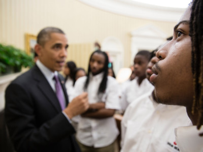 Students from William R. Harper High School in Chicago, Illinois, listen as President Barack Obama talks with them about the Emancipation Proclamation hanging in the Oval Office, June 5, 2013.