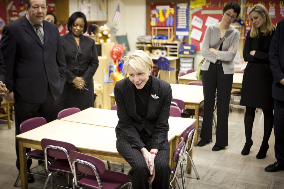 New NYC schools chancellor Cathleen P. Black listens to students inside PS 329 on December 13, 2010, in Brooklyn, New York. Black, the chairwoman of Hearst Magazines, will formerly begin as NYC Chancellor on January 2, 2011.