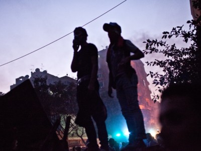 Demonstrators engage in street battles with Egyptian security forces on the corner of Mohamed Mahmoud and Mansour Street in downtown Cairo on November 23, 2011, in Cairo, Egypt.