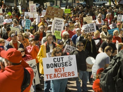 Protesters demonstrate at the Rally To Save The American Dream in Los Angeles, California. Rallies were held nationwide in major cities February 26, 2011.