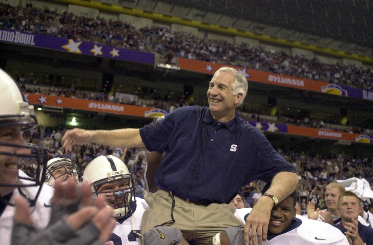 In this file photograph from December 28, 1999, former Penn State defensive coordinator Jerry Sandusky is carried off the field after a victory in the Alamo Bowl against Texas A&M. On November 5, 2011, Sandusky was arrested on charges that he preyed on boys he met through The Second Mile, a charity he founded for at-risk youths.