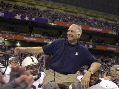 In this file photograph from December 28, 1999, former Penn State defensive coordinator Jerry Sandusky is carried off the field after a victory in the Alamo Bowl against Texas A&M. On November 5, 2011, Sandusky was arrested on charges that he preyed on boys he met through The Second Mile, a charity he founded for at-risk youths.