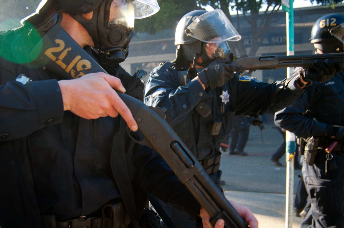 Oakland Police Officers move in with "non-lethal" ammunition on Occupy protesters, January 28, 2012.