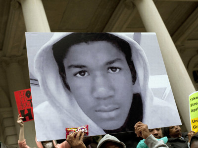 People along with New York City Council members attend a press conference to call for justice in the February 26 killing of 17-year-old Trayvon Martin in Sanford, Florida, on the steps of City Hall, March 28, 2012, in New York City.