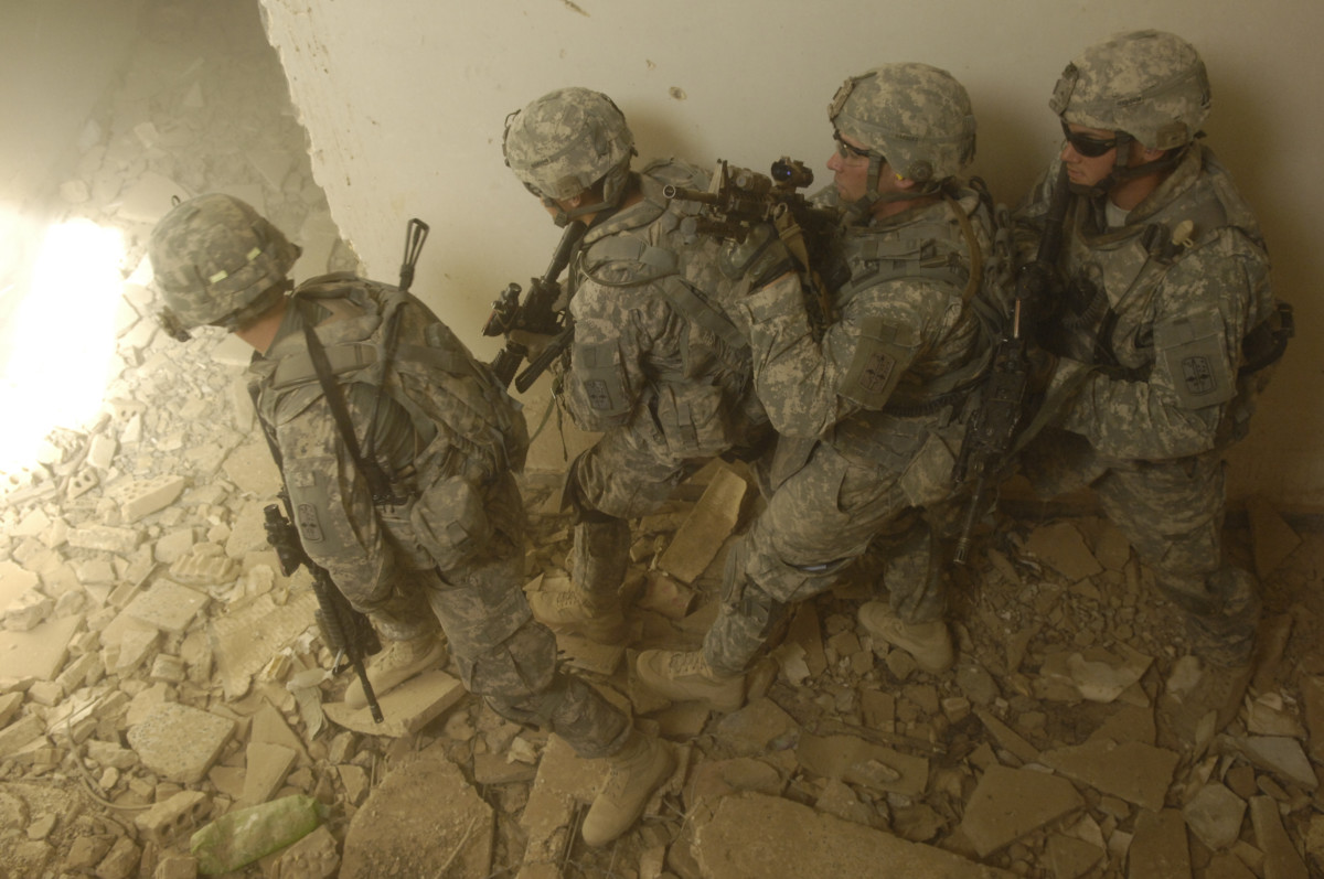 U.S. Soldiers from Echo Company, 5th Cavalry Regiment, 172nd Infantry Brigade prepare to clear a room in a joint training exercise near Bahbahani, Iraq, on June 4.