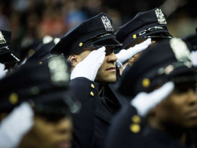 Police officers attend their New York Police Department graduation ceremony at Madison Square Garden on December 29, 2014, in New York City.