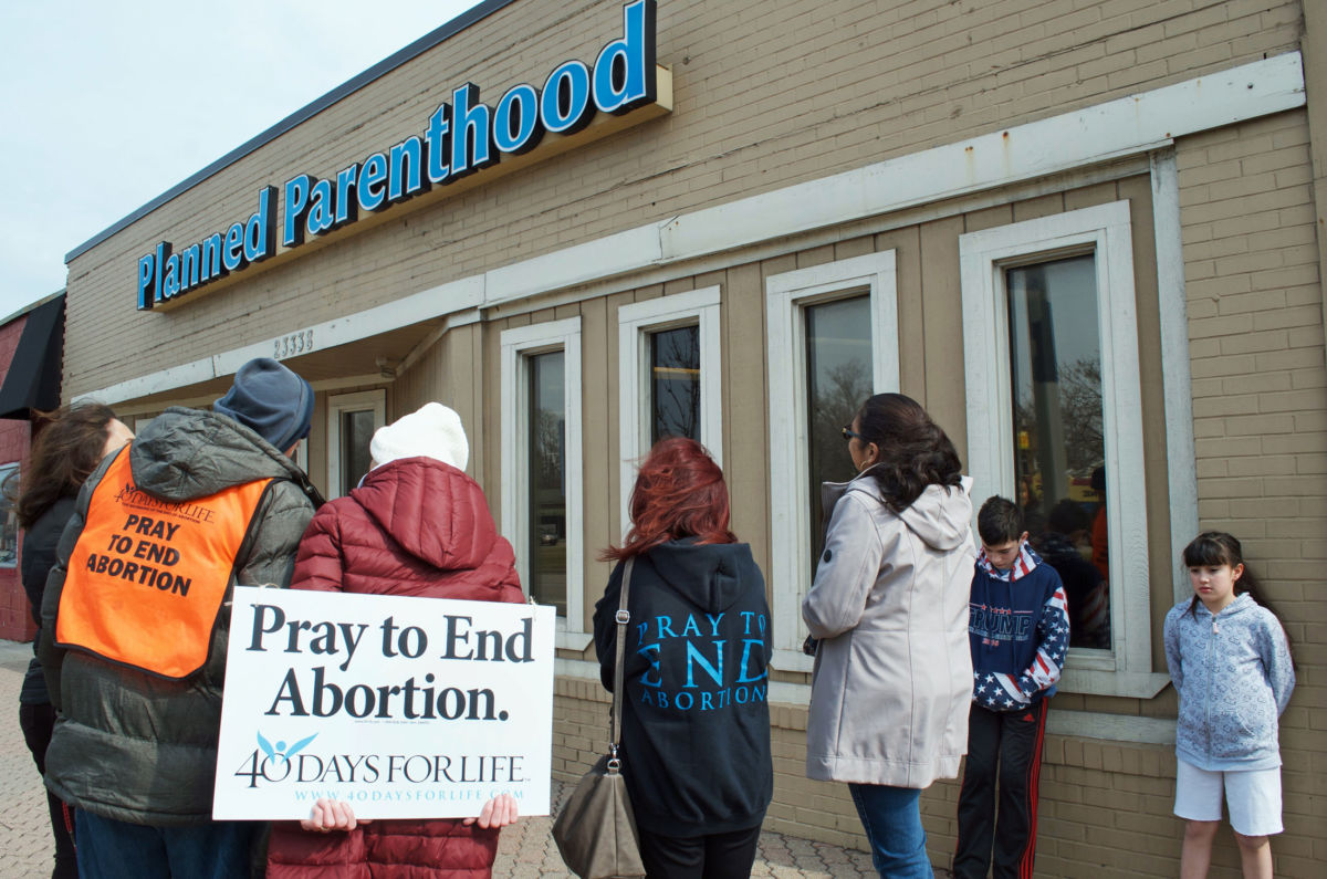 Anti-choice demonstrators gather around Planned Parenthood, March 24, 2017, in Ferndale, Michigan.