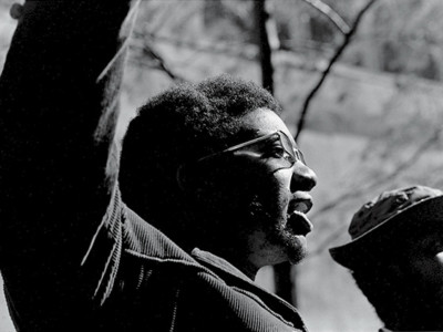 American political and social activist and Black Panther Party member Fred Hampton (1948 - 1969) raises his arms at the "Days of Rage" rally, Chicago, Illinois, October 11, 1969.