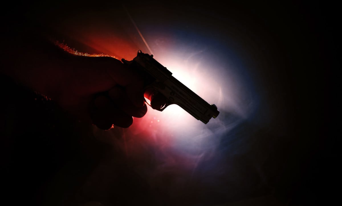 Smoking handgun with red and blue light