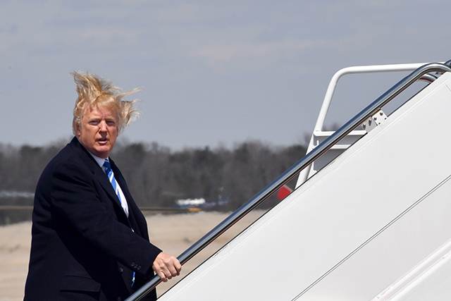 Donald Trump boards Air Force One at Andrews Air Force base on April 5, 2018, near Washington, DC.