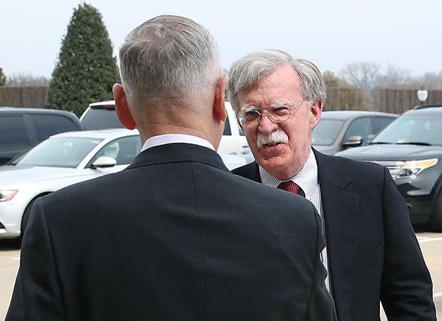 Secretary of Defense Jim Mattis greets incoming National Security Adviser John Bolton upon his arrival for a meeting at the Pentagon, on March 29, 2018, in Arlington, Virginia.