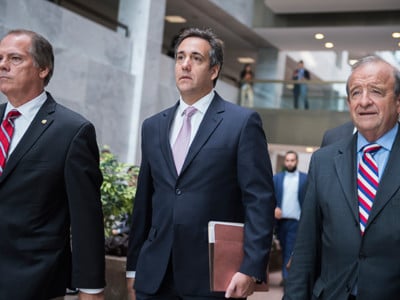 Michael Cohen, center, President Trump's personal attorney, leaves the Hart Building after his meeting with the Senate Intelligence Committee to discuss Russian election interference was postponed on September 19, 2017.