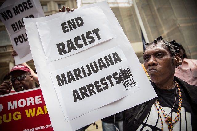 Elizabeth Owens protests on the steps of New York City Hall on July 9, 2014, in New York City.