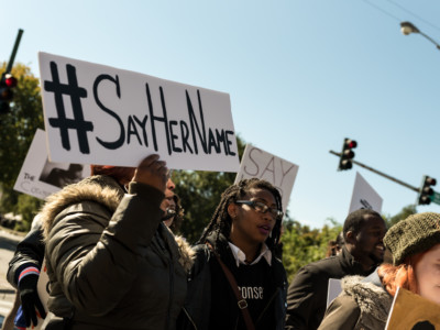 Activists display signs during the #March4BlackGirls on October 17, 2015, in Chicago, Illinois.