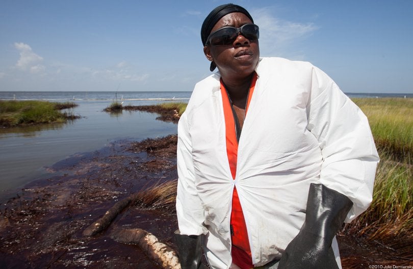 BP oil spill cleanup worker, without a respirator, at an oiled wetland in 2010. 
