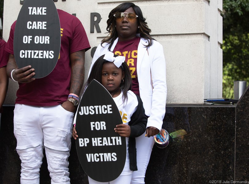 Tiffany Odoms with her daughter at a rally on the BP oil spill anniversary.