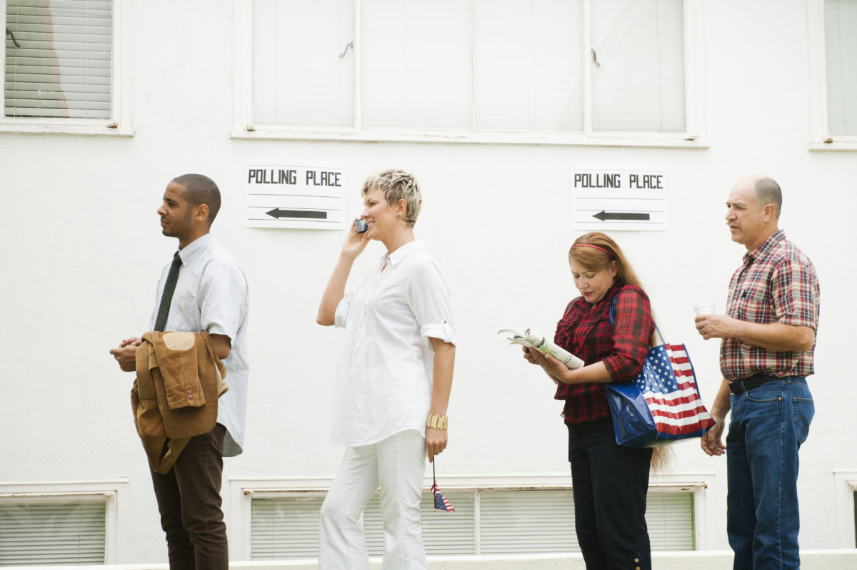 People standing in line waiting to vote