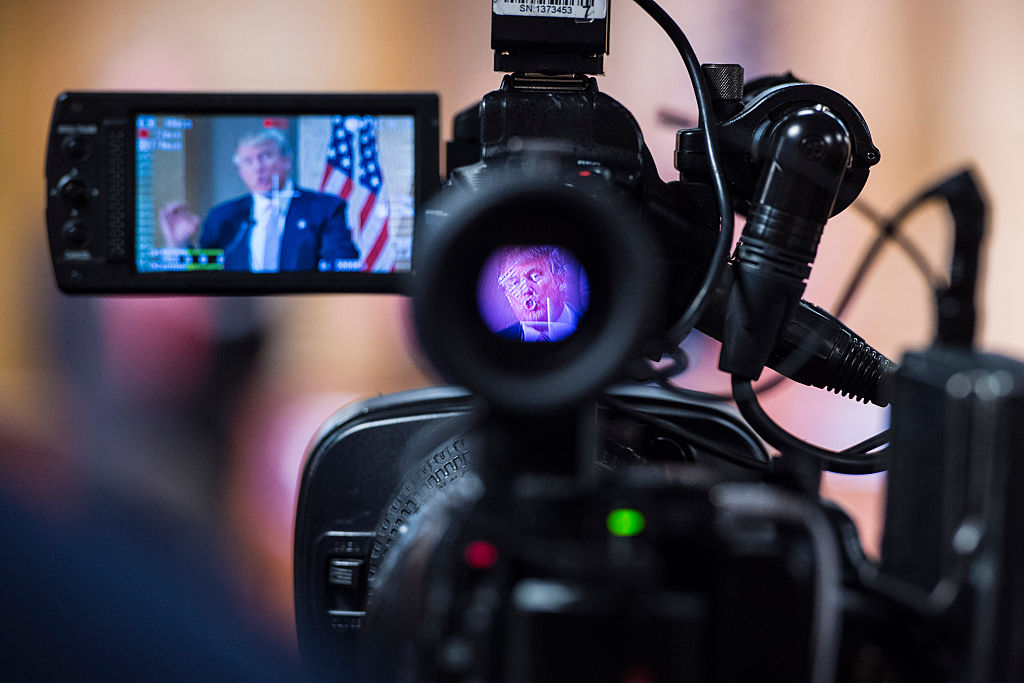 Donald Trump is seen speaking through a camera at a press conference in Hanahan, South Carolina, on February 15, 2016.