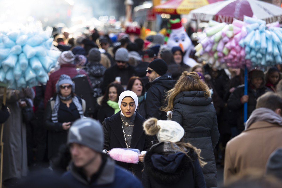 A Muslim woman walks along Fifth Avenue on Christmas day on December 25, 2017, in New York City.