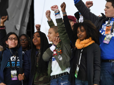 Marjory Stoneman Douglas High School student, Emma Gonzalez, center, stands next to Naomi Wadler, 11, of Alexandria, Virginia, right, near the conclusion of March for Our Lives on Saturday March 24, 2018, in Washington, DC.