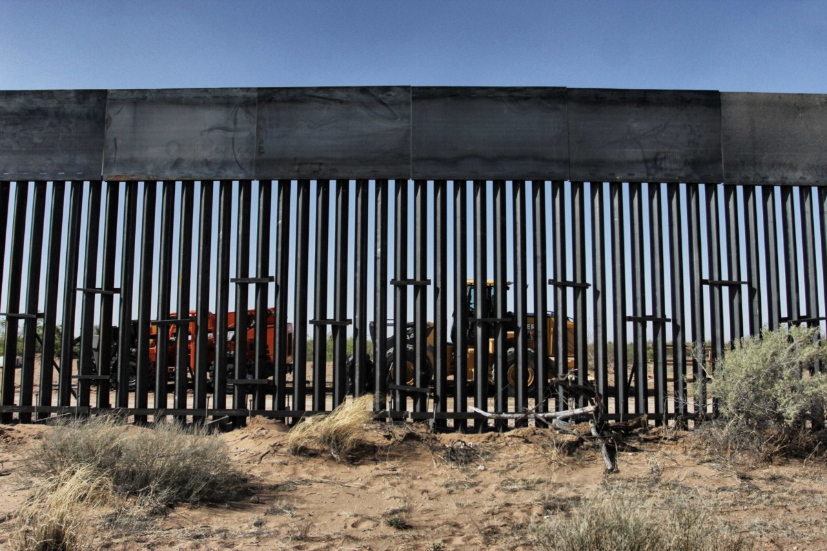 Workers are photographed during construction of bollard-style wall prototype by order of President Trump on the border between Ciudad Juarez, Mexico, and Santa Teresa, New Mexico, on April 17, 2018.