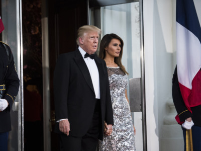 Donald and Melania Trump walk out to the North Portico to greet French President Emmanuel Macron and his wife Brigitte Macron as the Trumps host a state dinner at the White House on Tuesday, April 24, 2018, in Washington, DC.