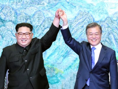 North Korean leader Kim Jong Un and South Korean President Moon Jae-in pose for photographs after signing the Panmunjom Declaration for Peace, Prosperity and Unification of the Korean Peninsula during the Inter-Korean Summit at the Peace House on April 27, 2018, in Panmunjom, South Korea.