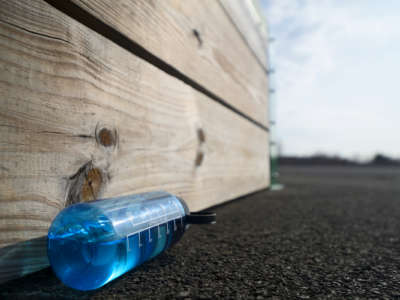 Somebody's forgotten nalgene lies on the ground