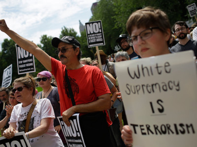 Demonstrators protest against hate, white supremacy groups and US President Donald Trump on Sunday, August 13, 2017, in Chicago, Illinois. Protesters were responding to violent clashes in Charlottesville, Virginia, after 3 people were killed and several injured.