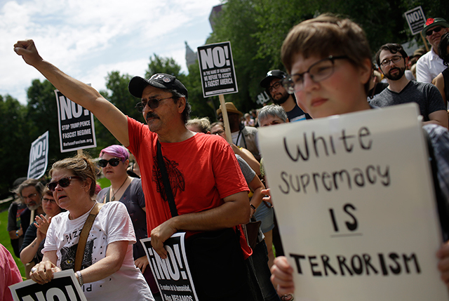 Demonstrators protest against hate, white supremacy groups and US President Donald Trump on Sunday, August 13, 2017, in Chicago, Illinois. Protesters were responding to violent clashes in Charlottesville, Virginia, after 3 people were killed and several injured.
