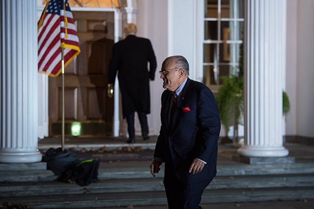 Rudy Giuliani walks to a vehicle after a meeting at the clubhouse at Trump National Golf Club Bedminster in Bedminster Township, New Jersey, on Sunday, November 20, 2016.