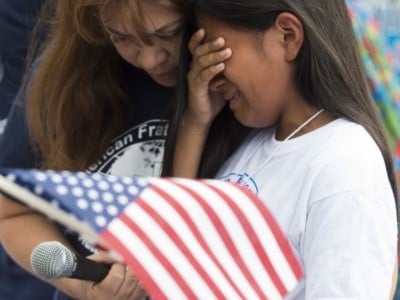 A young girl whose father was deported protest, cries during a protest in response to US President Barack Obama's delay on immigration reform in front of the White House in Washington, DC, September 8, 2014.