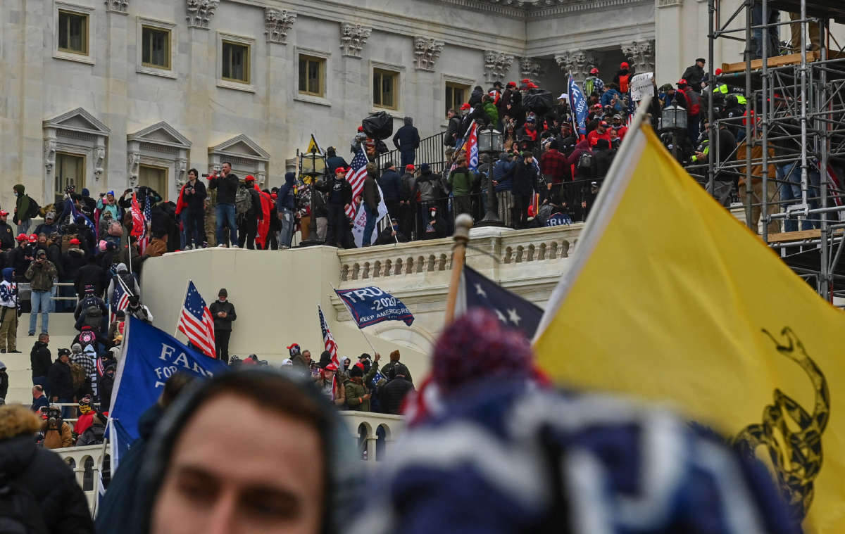 Trump supporters take over the inaugural stage at the U.S. Capitol on January 6, 2021, in Washington, D.C.