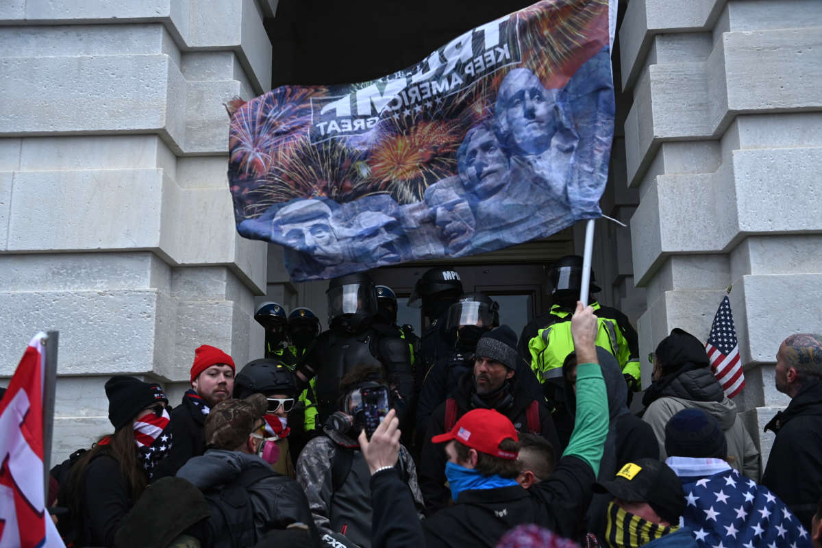 Trump supporters clash with police and security forces as they storm the U.S. Capitol in Washington, D.C., on January 6, 2021.