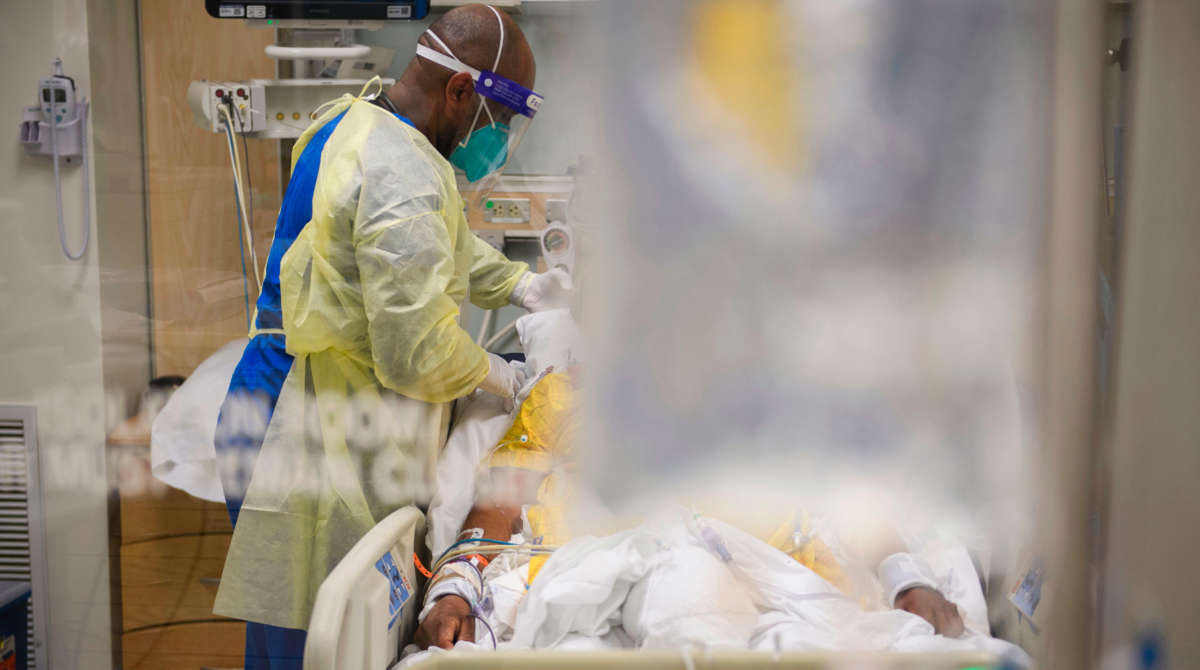 Nurses wearing personal protective equipment attend to patients in a COVID-19 intensive care unit at Martin Luther King Jr. Community Hospital on January 6, 2021, in Los Angeles, California.