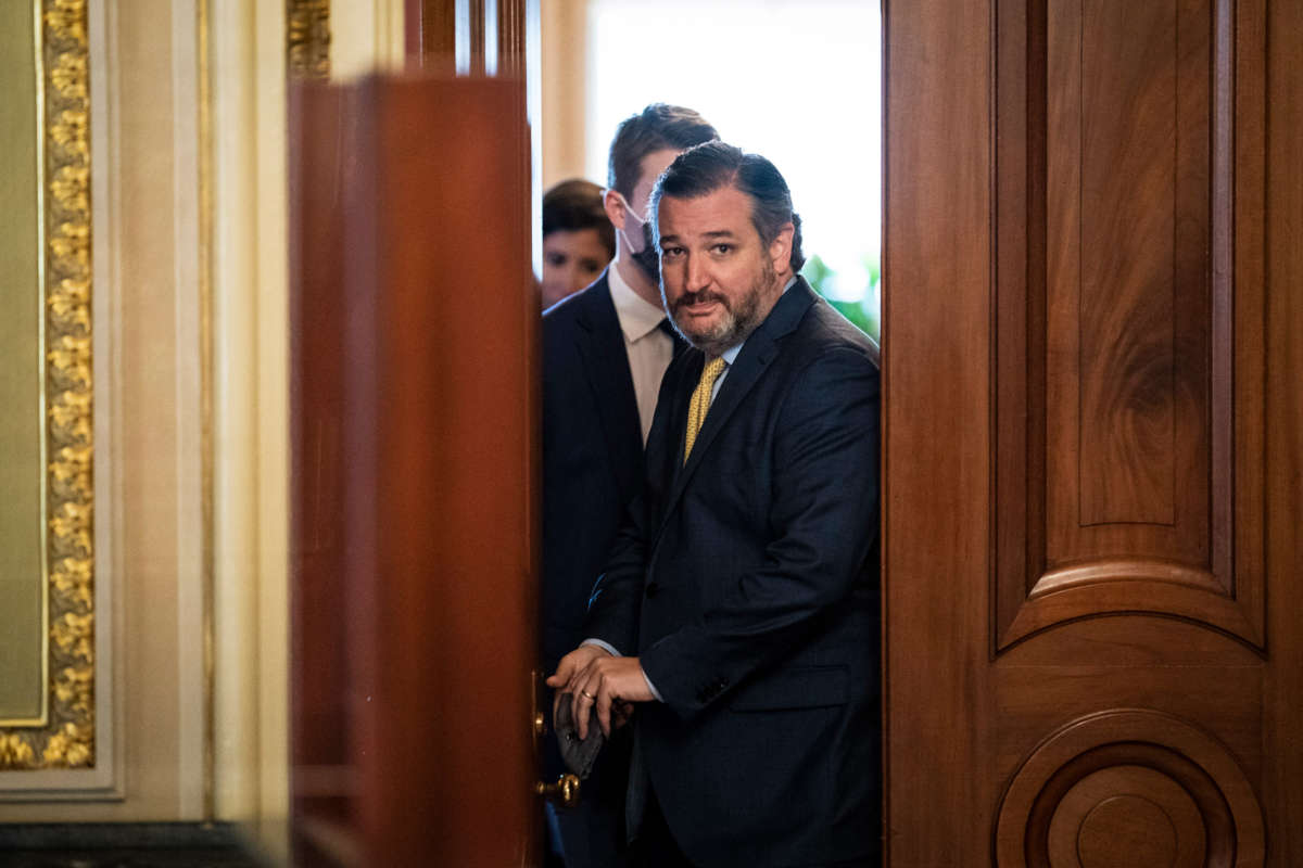 Sen. Ted Cruz walks out of a meeting room on Capitol Hill on February 12, 2021, in Washington, D.C.