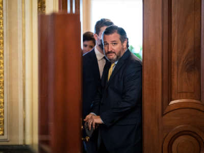 Sen. Ted Cruz walks out of a meeting room on Capitol Hill on February 12, 2021, in Washington, D.C.
