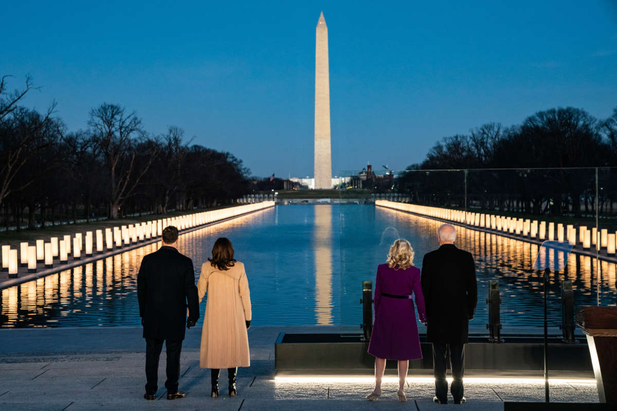 President-elect Joe Biden and his wife Dr. Jill Biden stand with Vice Presidential-elect Kamala Harris and her husband Doug Emhoff during a moment of silence at a COVID memorial event at the Lincoln Memorial in Washington, D.C.,January 19, 2021.