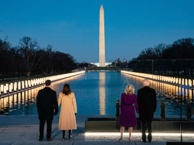 President-elect Joe Biden and his wife Dr. Jill Biden stand with Vice Presidential-elect Kamala Harris and her husband Doug Emhoff during a moment of silence at a COVID memorial event at the Lincoln Memorial in Washington, D.C.,January 19, 2021.