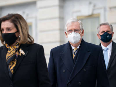 Speaker of the House Nancy Pelosi, Senate Minority Leader Mitch McConnell and House Minority Leader Kevin McCarthy arrive to watch the departure of ceremony of the remains of Officer Brian Sicknick leave the U.S. Capitol after laying in honor in the Rotunda on February 3, 2021, in Washington, D.C.