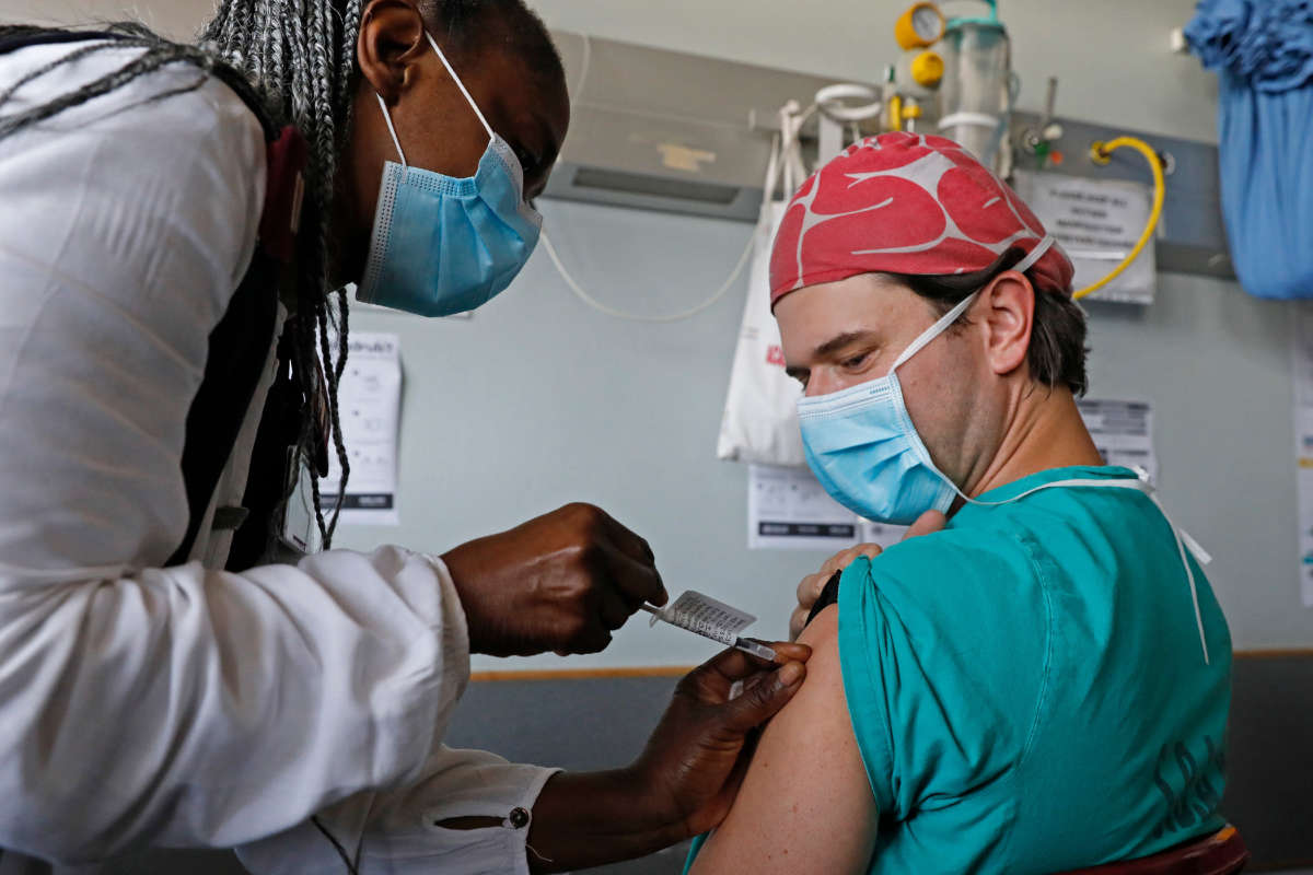 A healthcare worker receives a dose of the Johnson & Johnson vaccine against the COVID-19 coronavirus as South Africa proceeds with its inoculation campaign at the Steve Biko Academic Hospital in Pretoria on February 17, 2021.