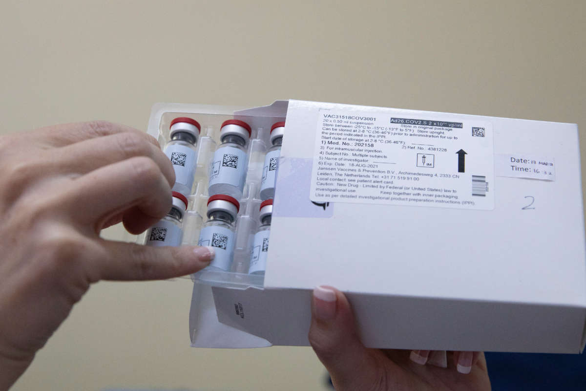 A healthcare worker holds vials containing doses of the Johnson & Johnson vaccine against the COVID-19 coronavirus at the Klerksdorp Hospital on February 18, 2021.