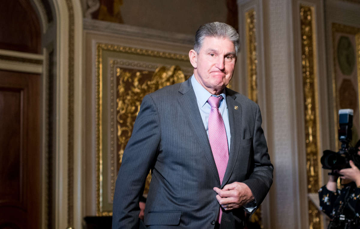 Sen. Joe Manchin walks through the Senate Reception Room to the Senate chamber on January 27, 2020.