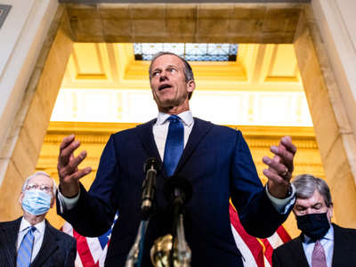 Senate Minority Whip John Thune is flanked by (L-R) Senate Minority Leader Mitch McConnell and Sen. Roy Blunt as he talks during a press conference on Capitol Hill on March 2, 2021, in Washington, D.C.