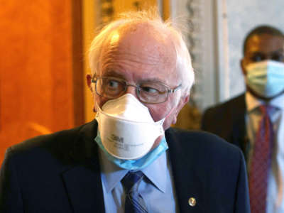 Sen. Bernie Sanders passes through a hallway at the U.S. Capitol on March 5, 2021, in Washington, D.C.