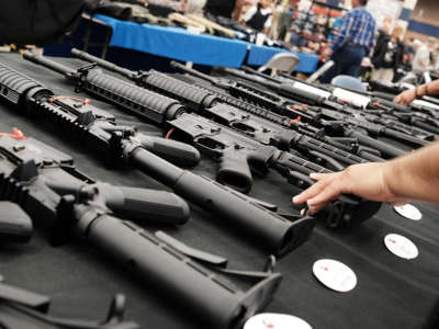 Guns sit for sale at a gun show on July 10, 2016, in Fort Worth, Texas.