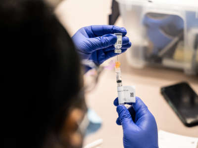 A nurse fills a syringe with a dose of the Johnson & Johnson COVID-19 vaccine at Wayside Christian Mission on March 15, 2021, in Louisville, Kentucky.