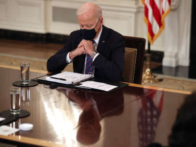President Joe Biden delivers brief remarks to the press during a meeting with members of his cabinet and immigration advisors in the State Dining Room on March 24, 2021, in Washington, D.C.